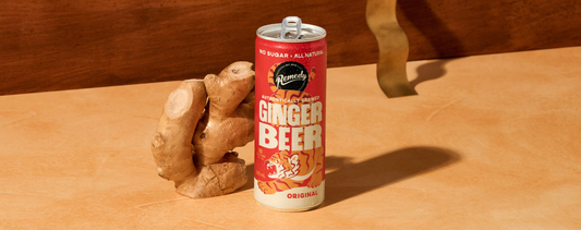 Can of Remedy Ginger Beer next to a piece of ginger